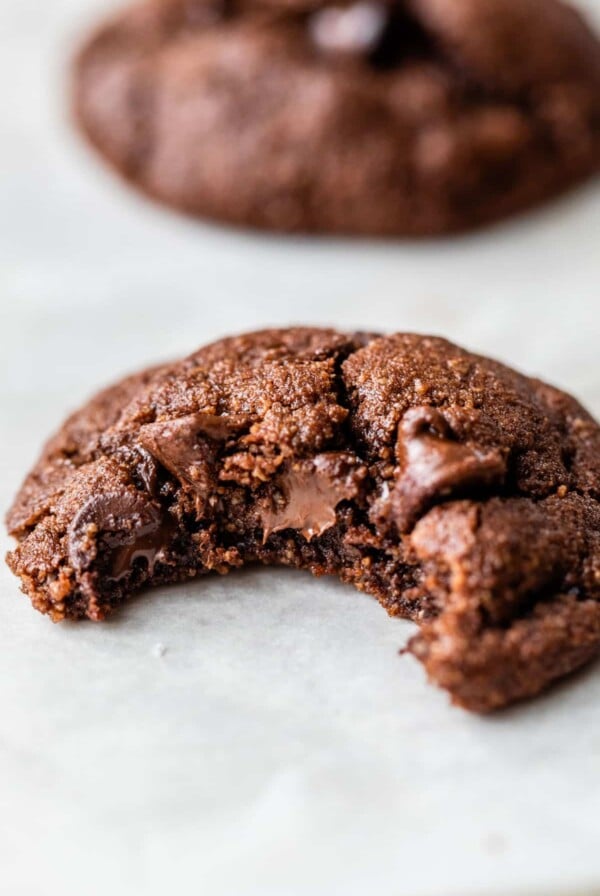 a chocolate cookie with a bite taken out of it