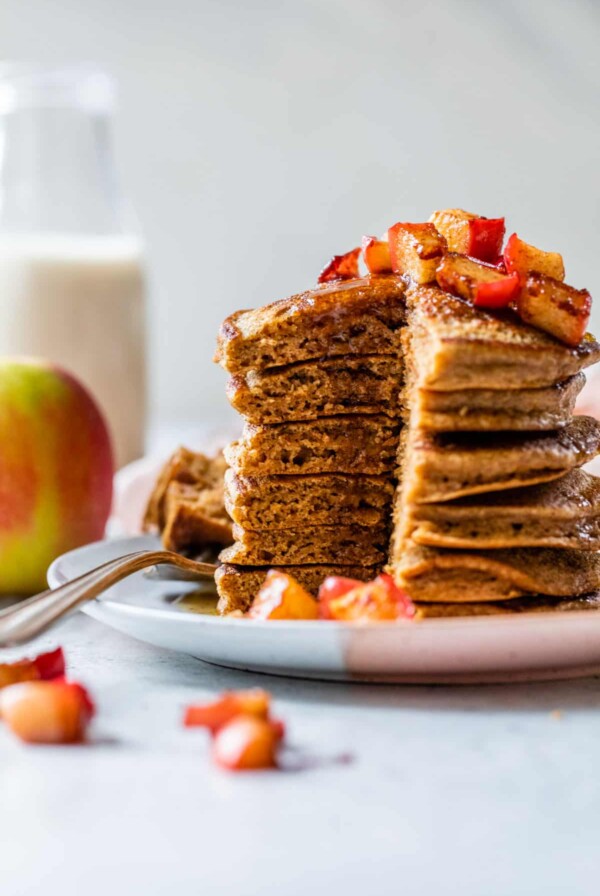a side view of a stack of pancakes with a large section taken out