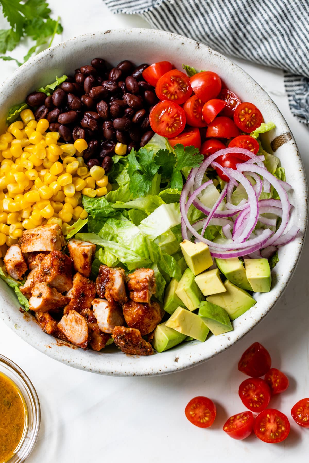 all salad ingredients sectioned off in a bowl
