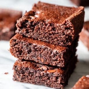 close up on a stack of 3 black bean brownies.