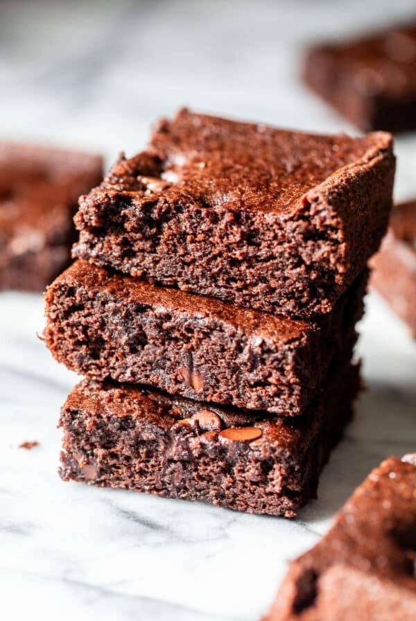 close up on a stack of 3 black bean brownies.