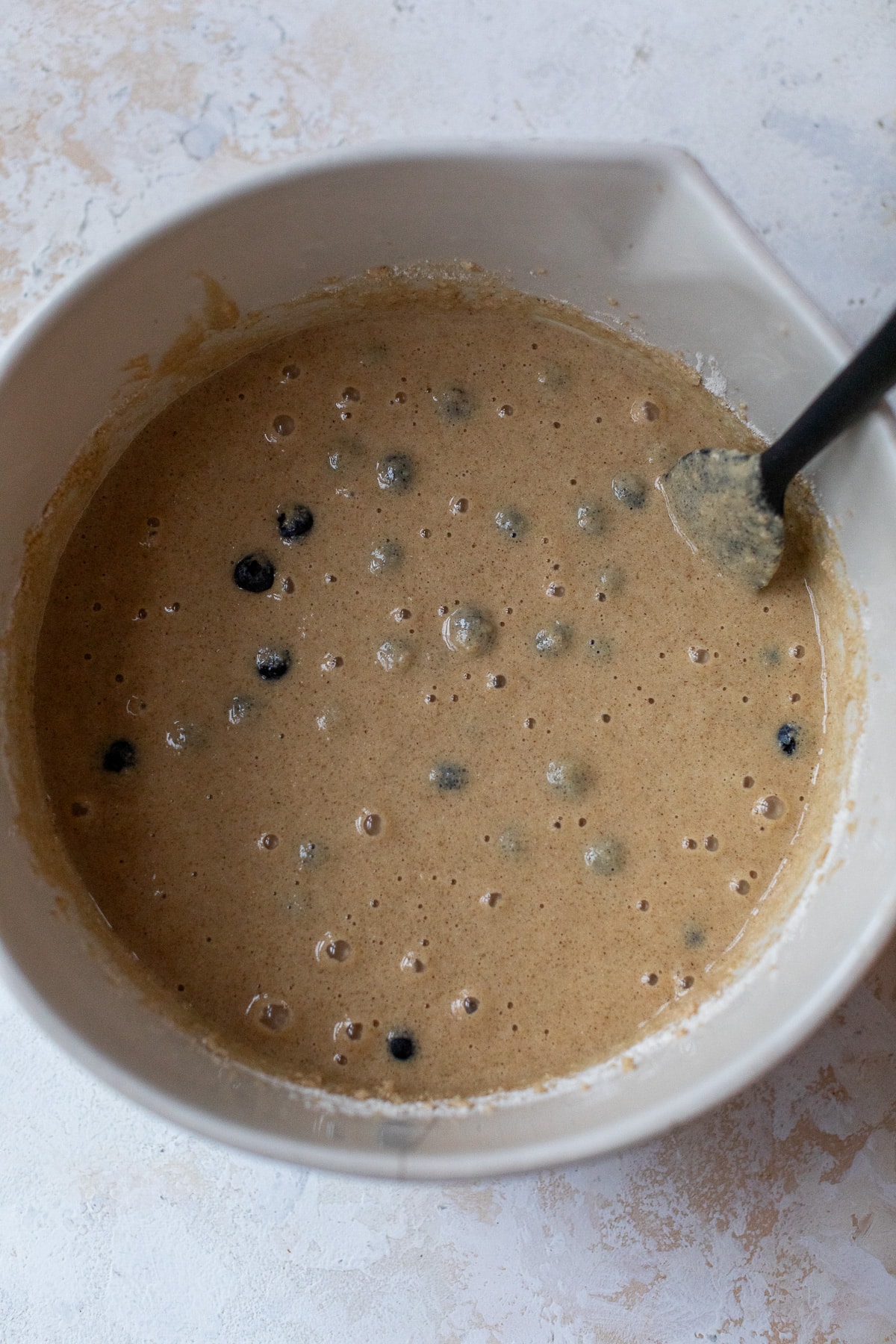 blueberry cake batter ina. large bowl with a spatula