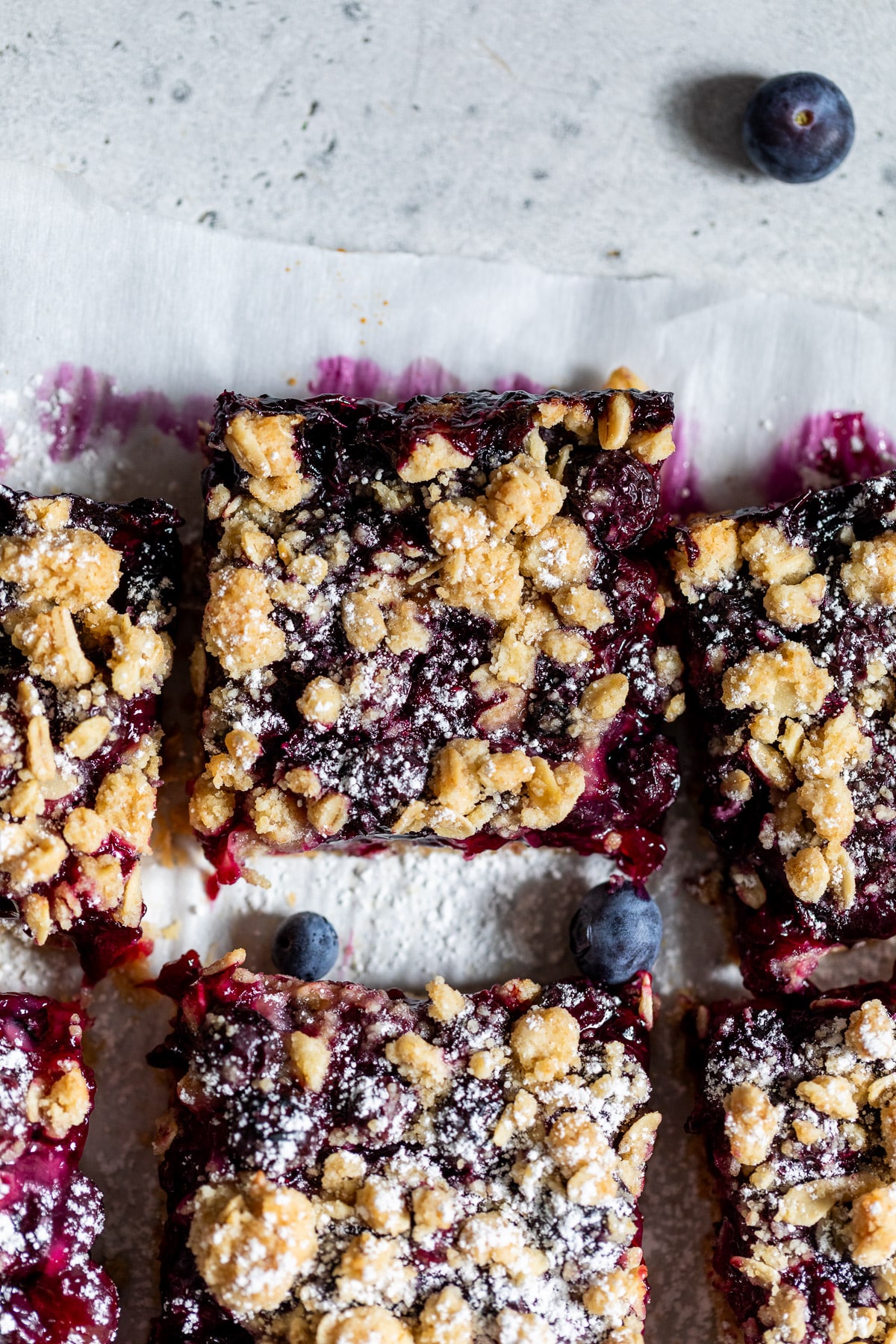 overhead view of sliced blueberry pie bars.
