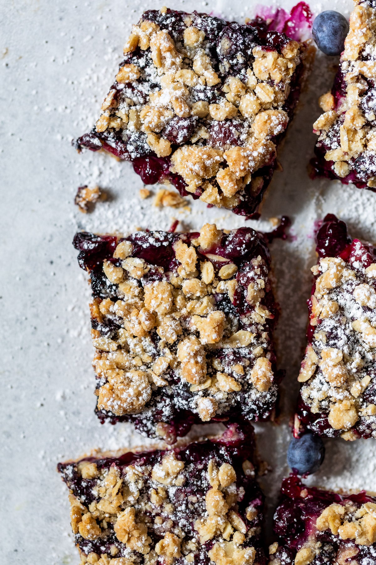 overhead view of sliced blueberry pie bars.
