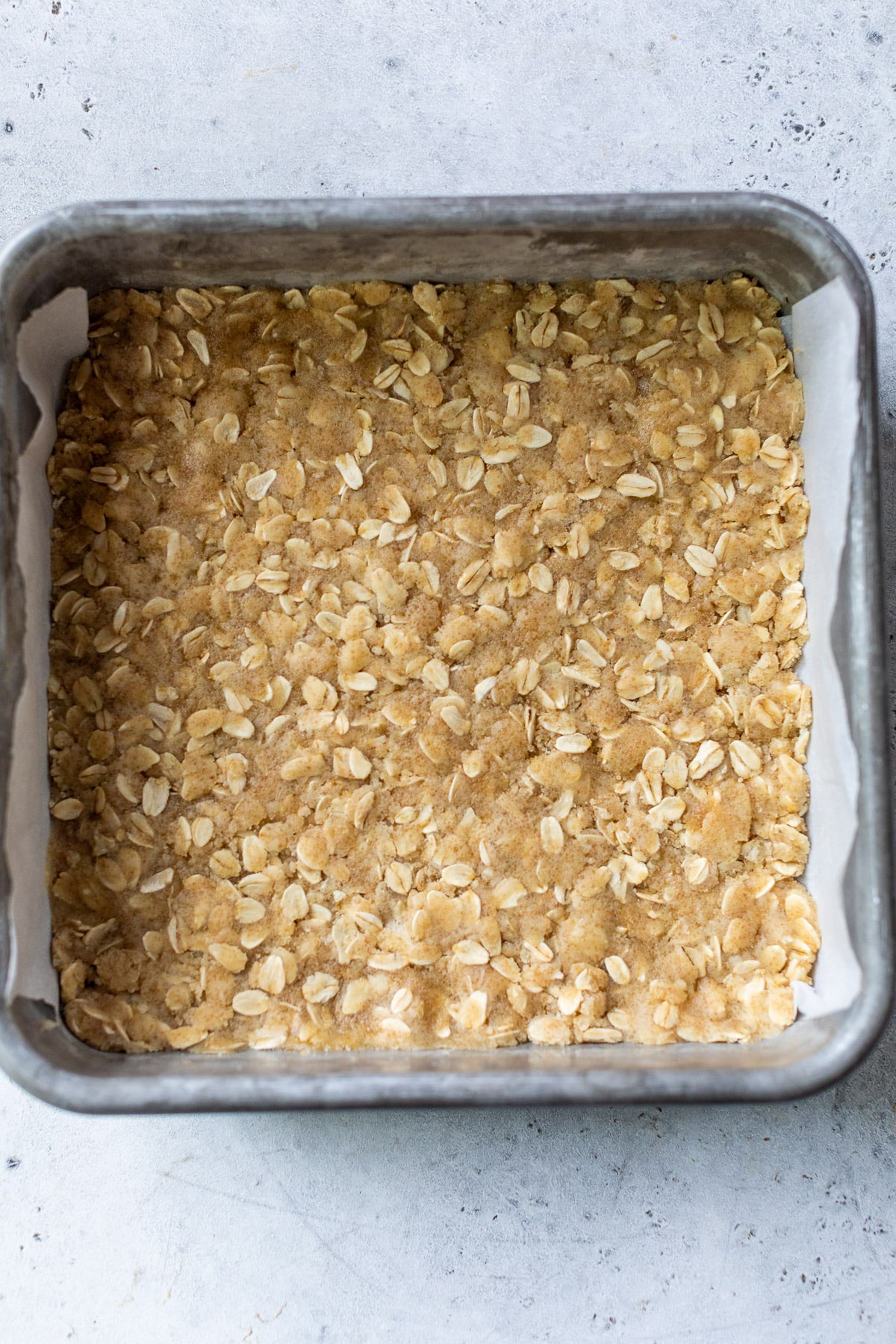 the crust for blueberry pie bars in a baking dish.