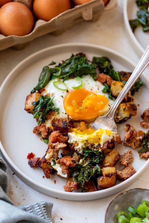 breakfast hash on a plate with a fork