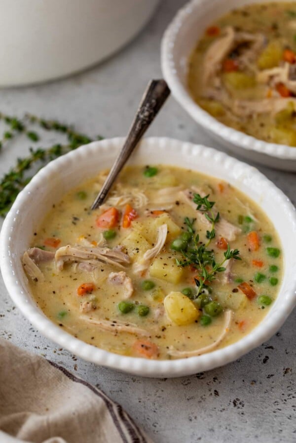 chicken pot pie soup in a bowl with a spoon