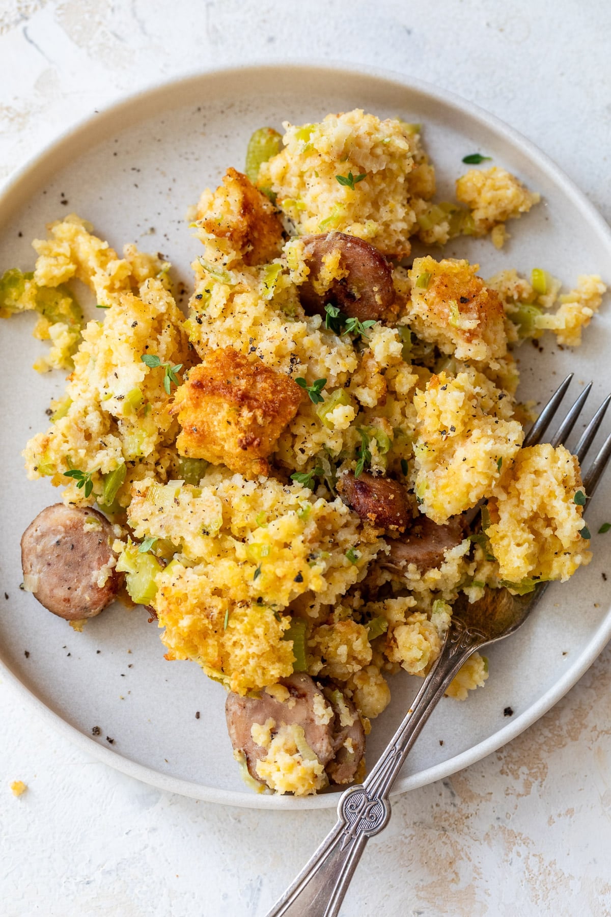 overhead view of a scoop of Chicken Sausage Cornbread Stuffing on a plate.