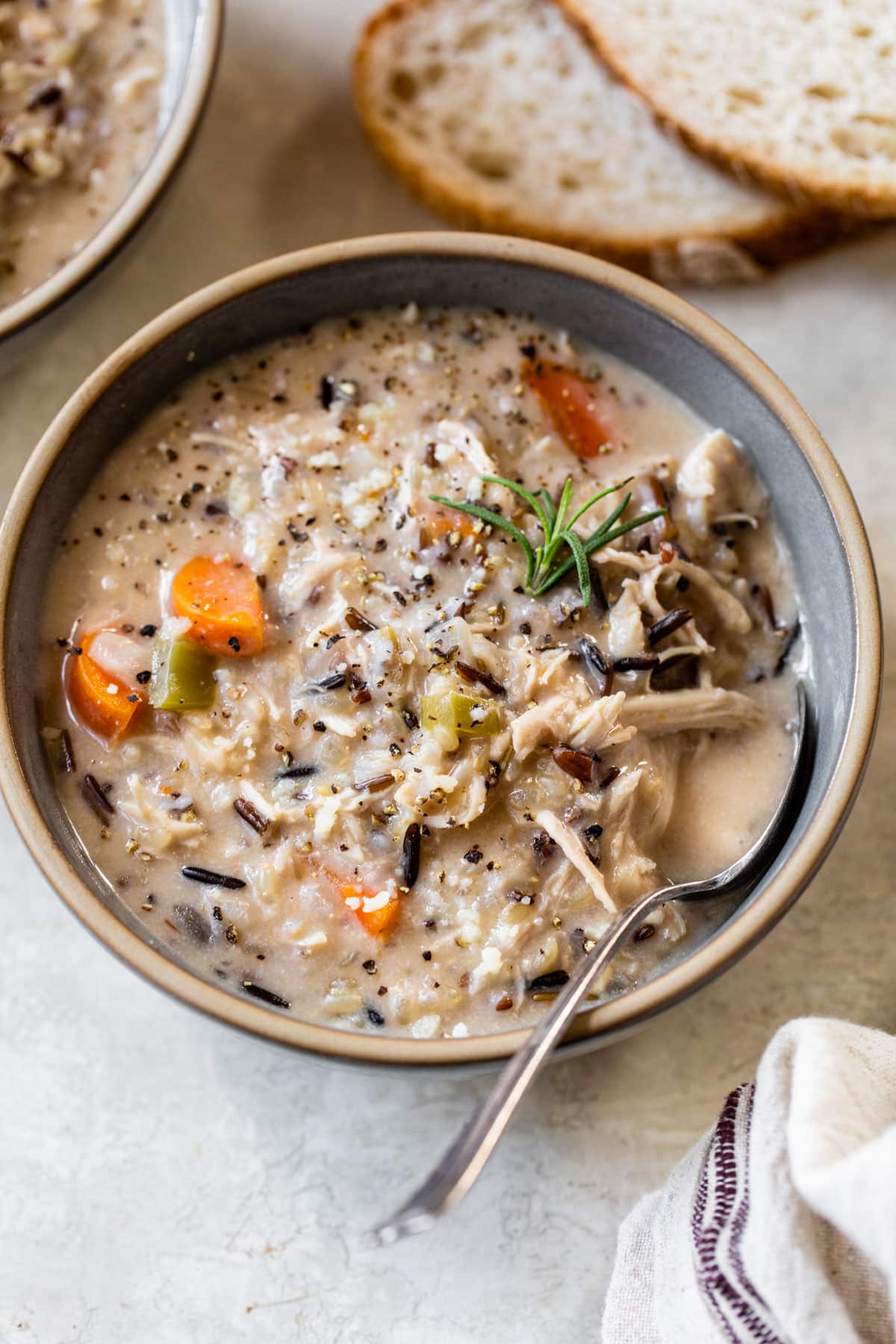chicken wild rice soup in a bowl with a spoon