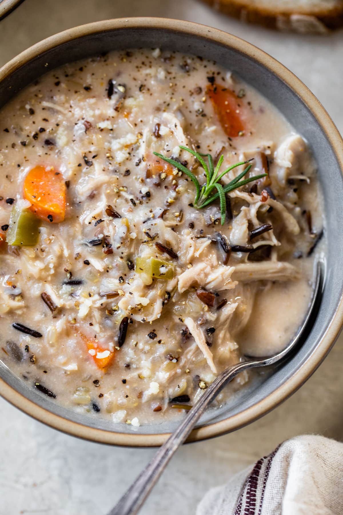 close-up of chicken wild rice soup in a bowl with a spoon