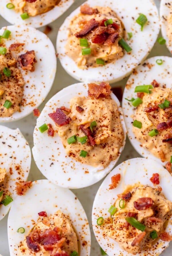 chipotle deviled eggs topped with chives