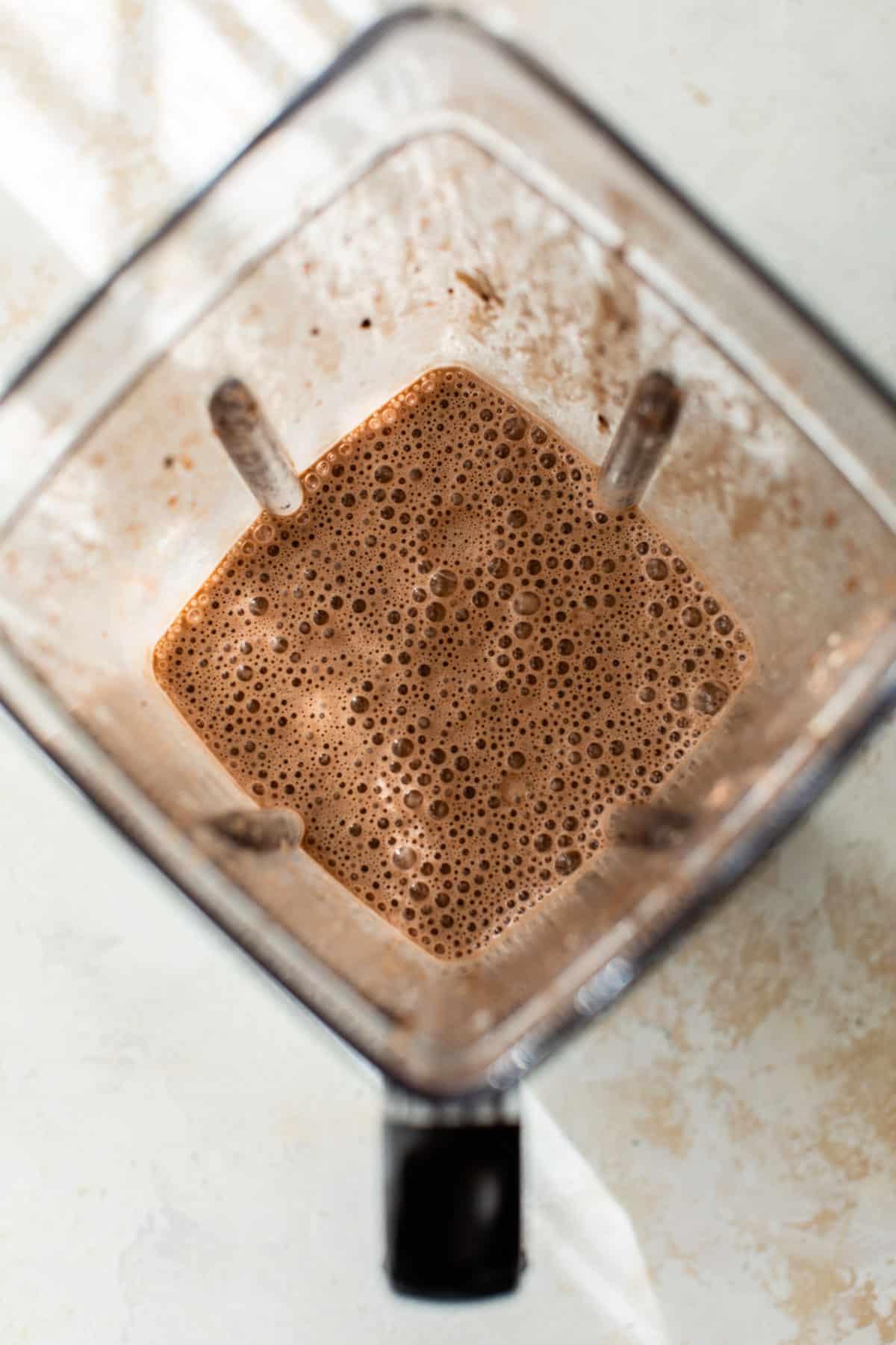 all smoothie ingredients blended together in a blender