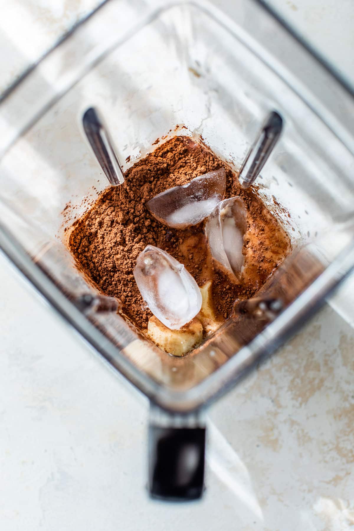 all smoothie ingredients added to a blender