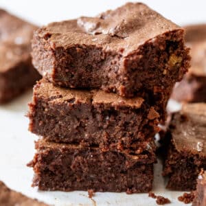close up on a stack of 3 cottage cheese brownies.