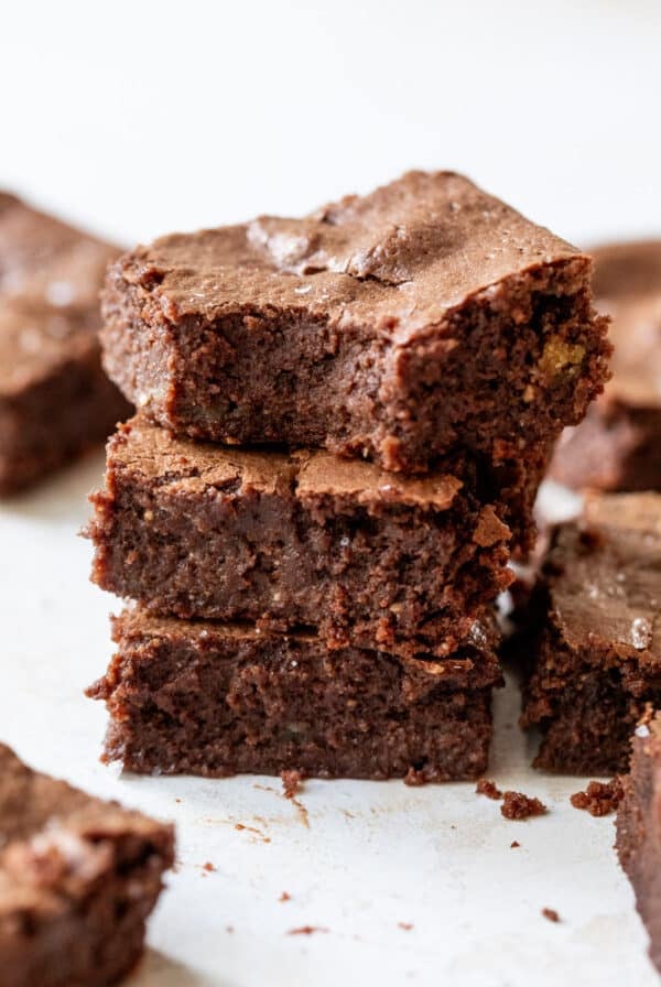 close up on a stack of 3 cottage cheese brownies.