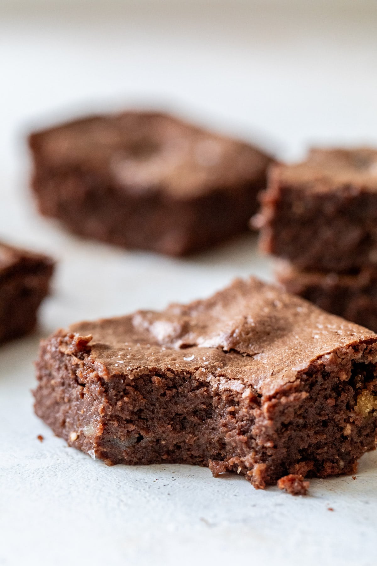 close up on a cottage cheese brownies with a bite taken out of it.