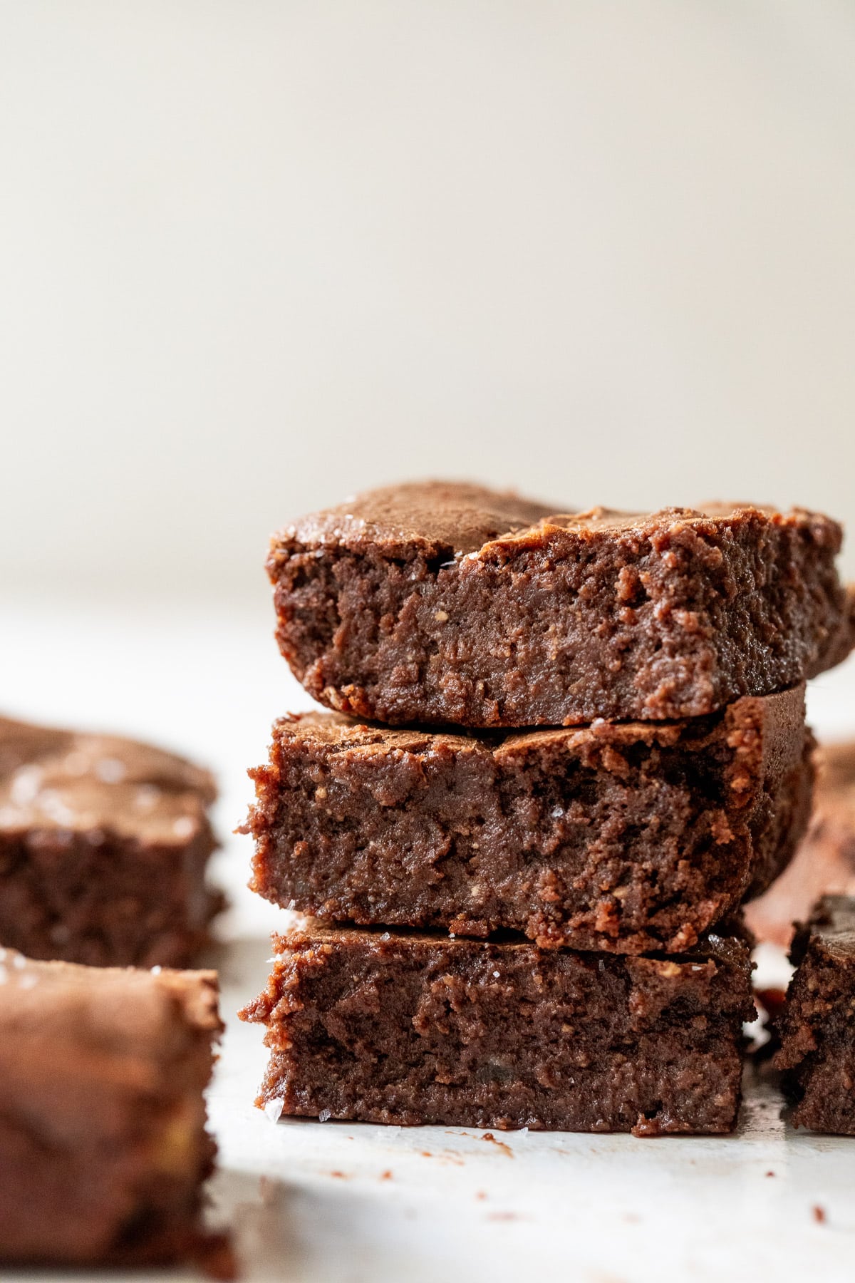 close up on a stack of 3 cottage cheese brownies.