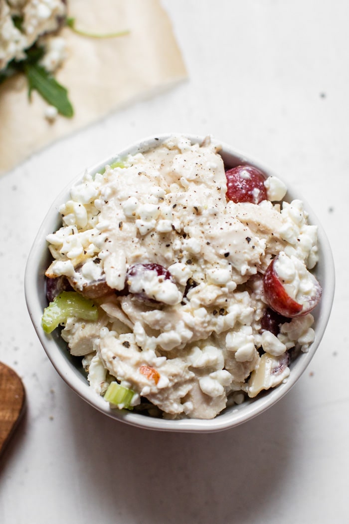 chicken with mayo and grapes in a bowl