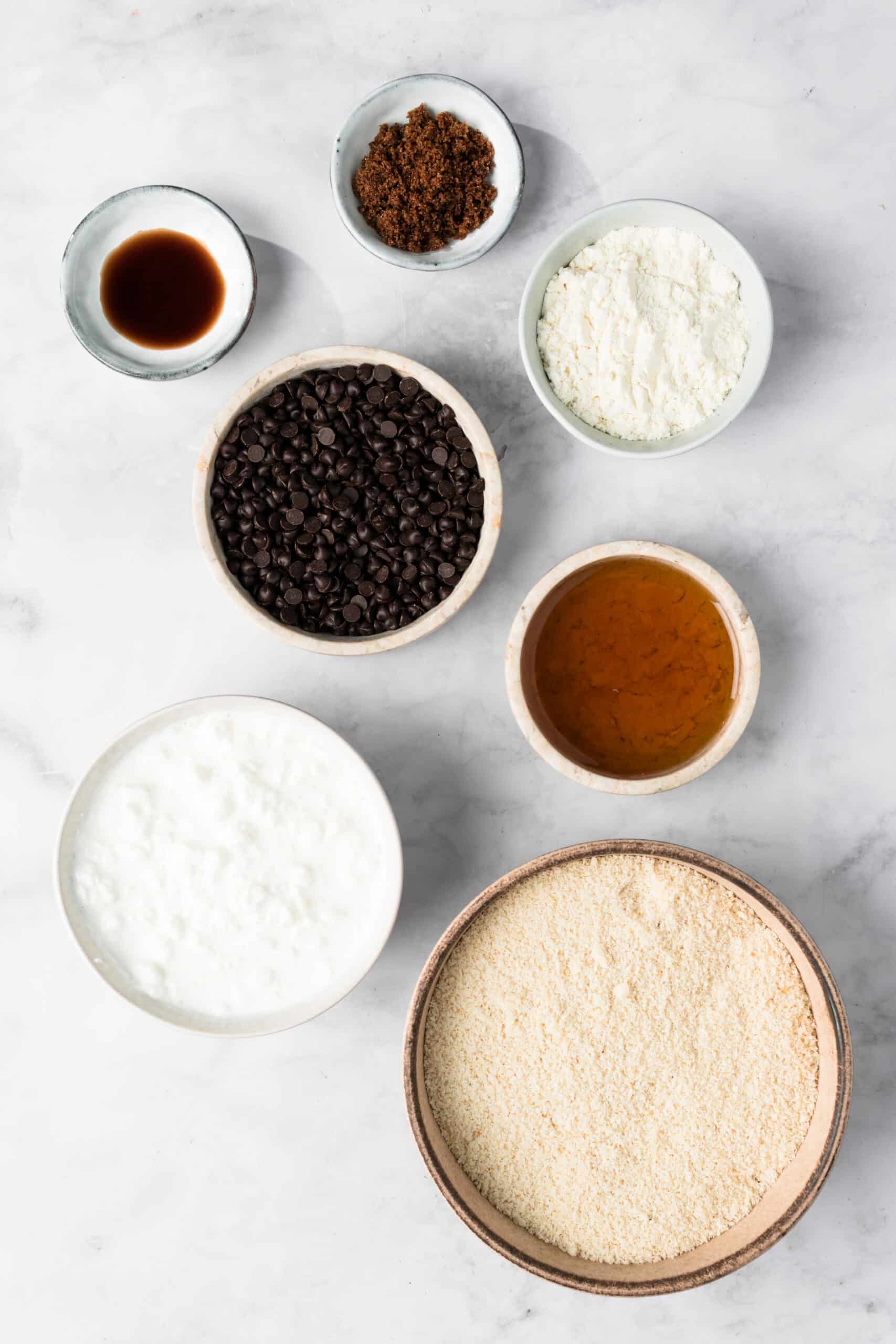 overhead view of the ingredients for cottage cheese cookie dough in individual bowls.