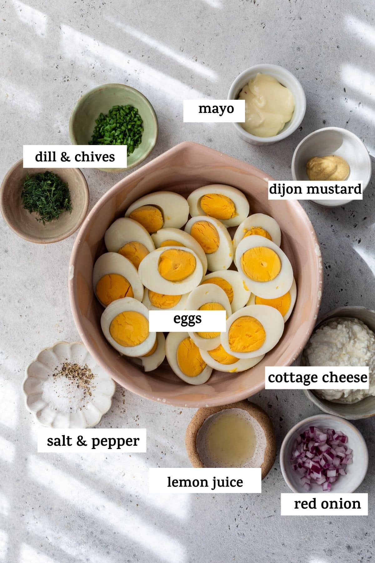 ingredients for Cottage Cheese Egg Salad in individual bowls with labels.