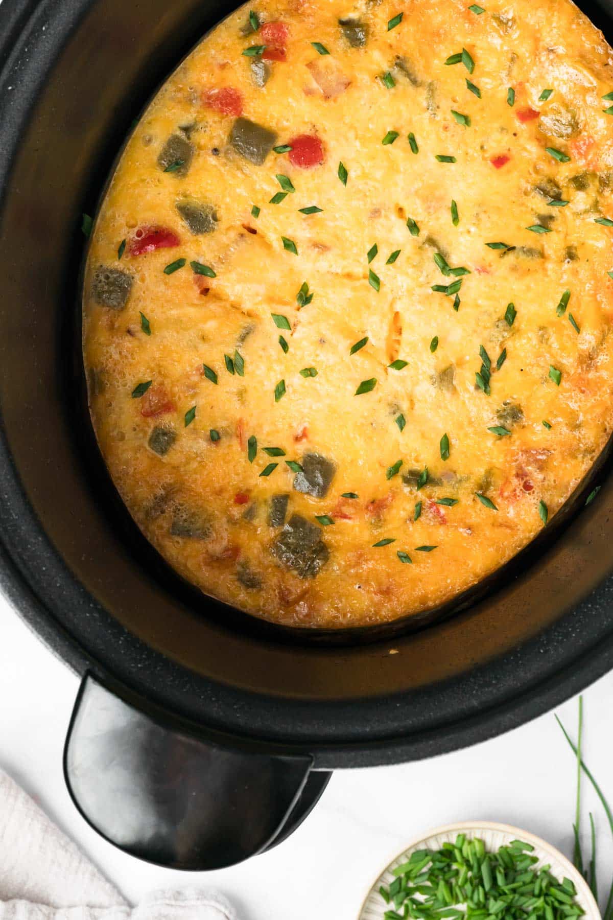 overhead view of a baked breakfast casserole in a crockpot.