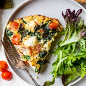 a slice of egg white frittata on a plate with a fork