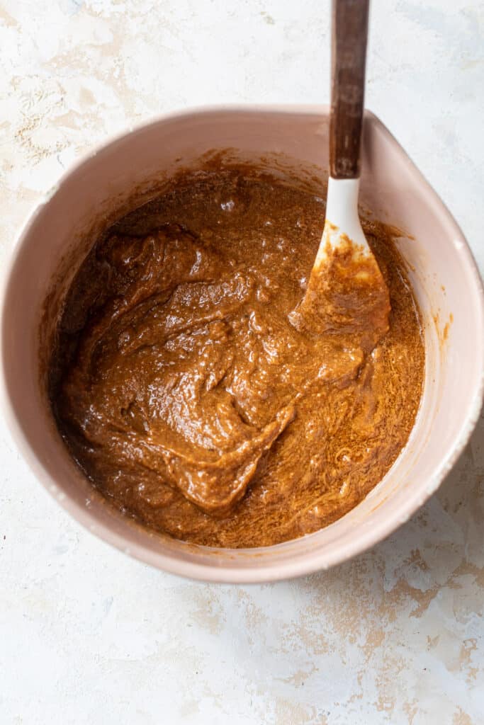 almond butter in a mixing bowl with a rubber spatula