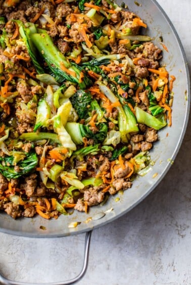 stir fry with pork and vegetables in a skillet