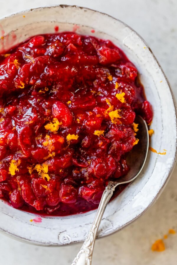 a bowl of cranberry sauce topped with orange zest