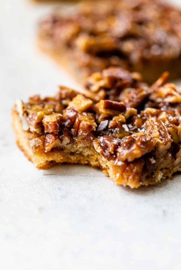side view of a healthy pecan pie bar with a bite taken out
