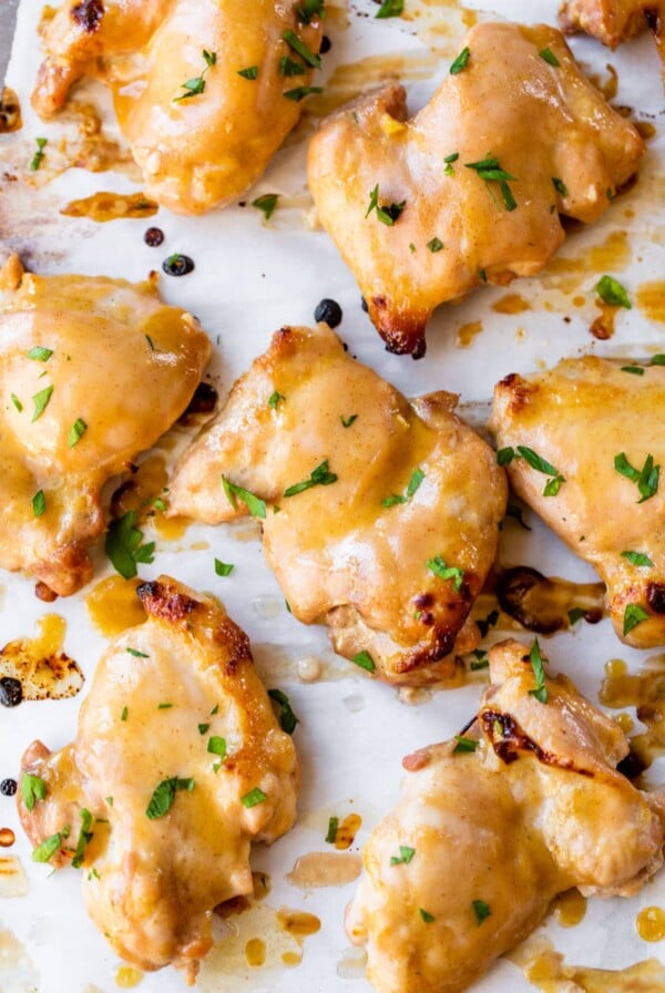 marinated boneless chicken thighs on parchment paper