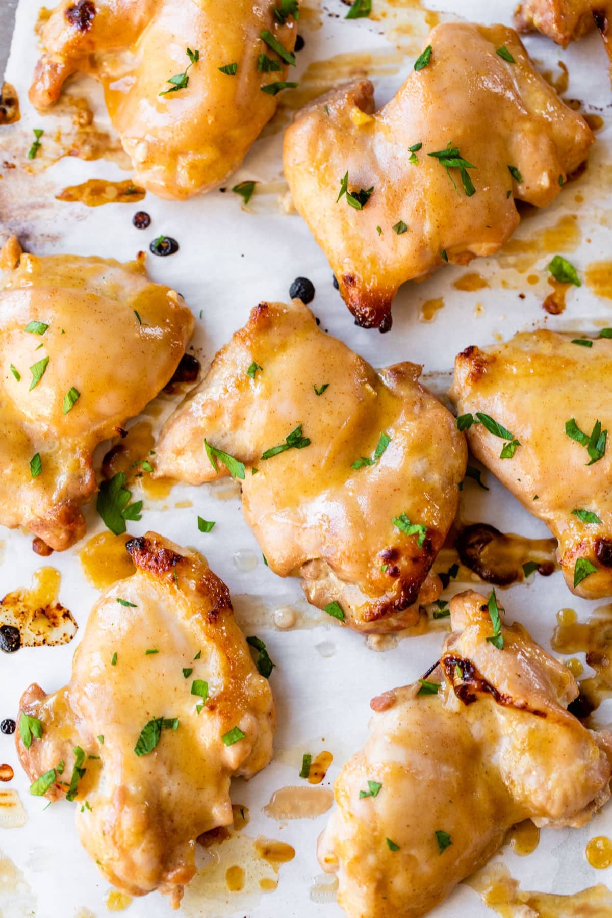 marinated boneless chicken thighs on parchment paper