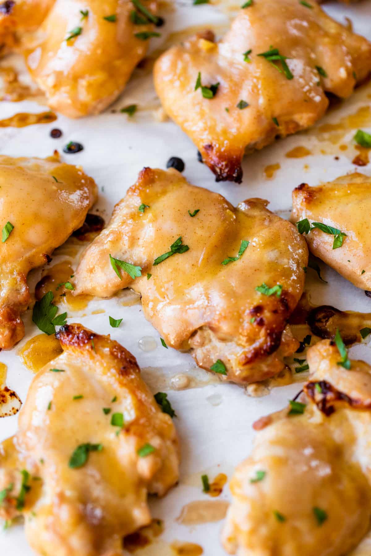 marinated chicken thighs on parchment paper