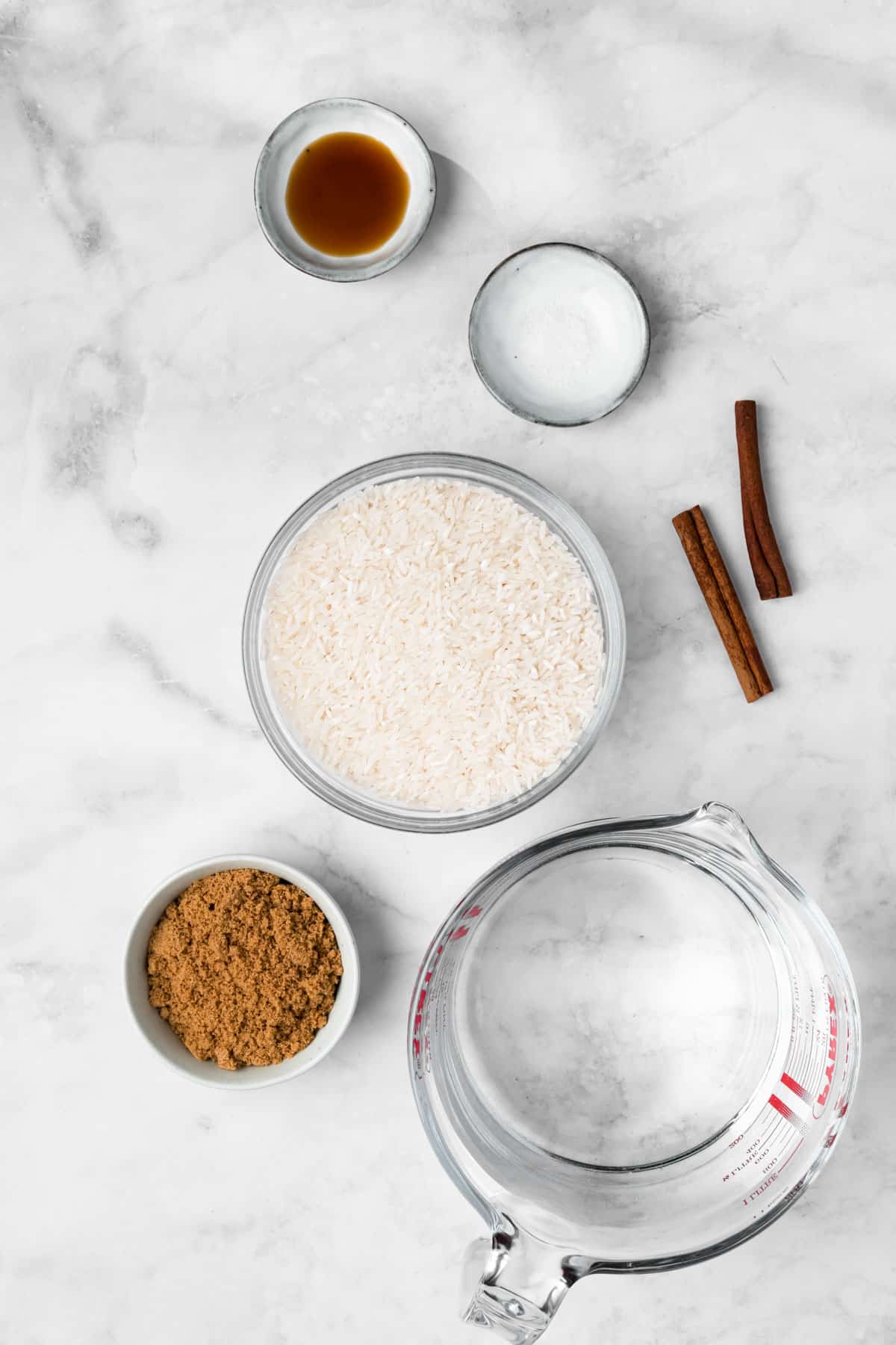overhead view of the ingredients for horchata in individual bowls.