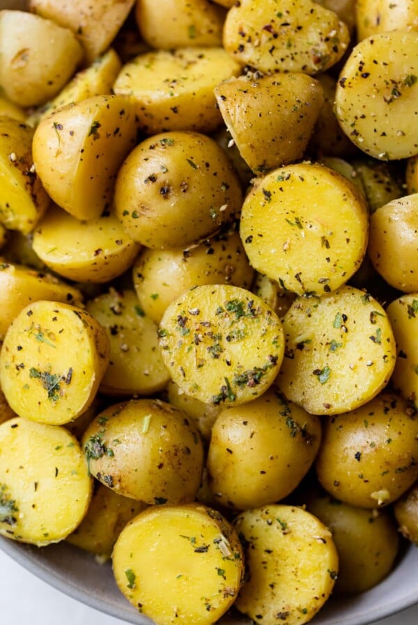 a close-up shot of instant pot potatoes with seasonings on them