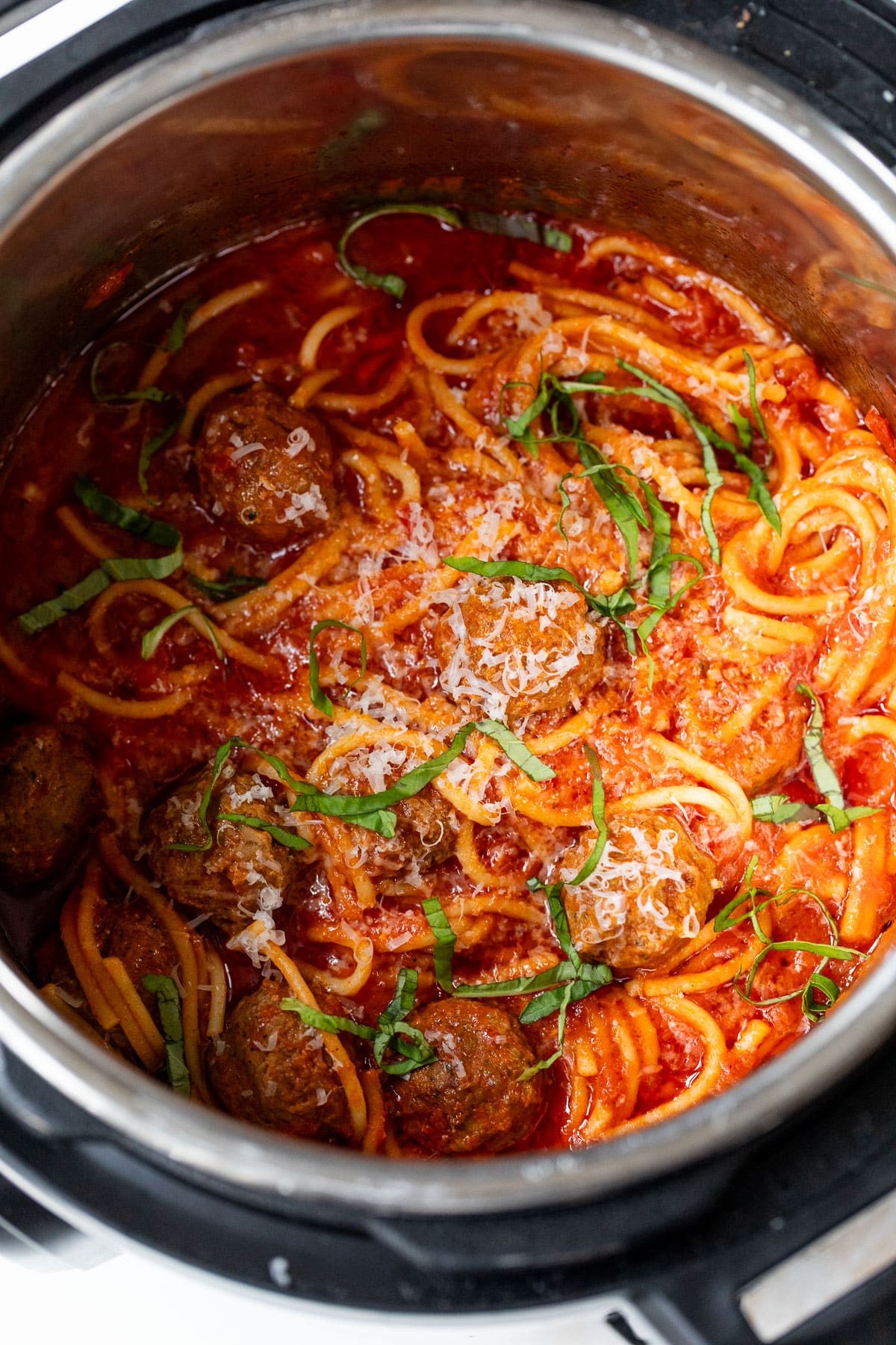 overhead view of spaghetti and meatballs in an instant pot.