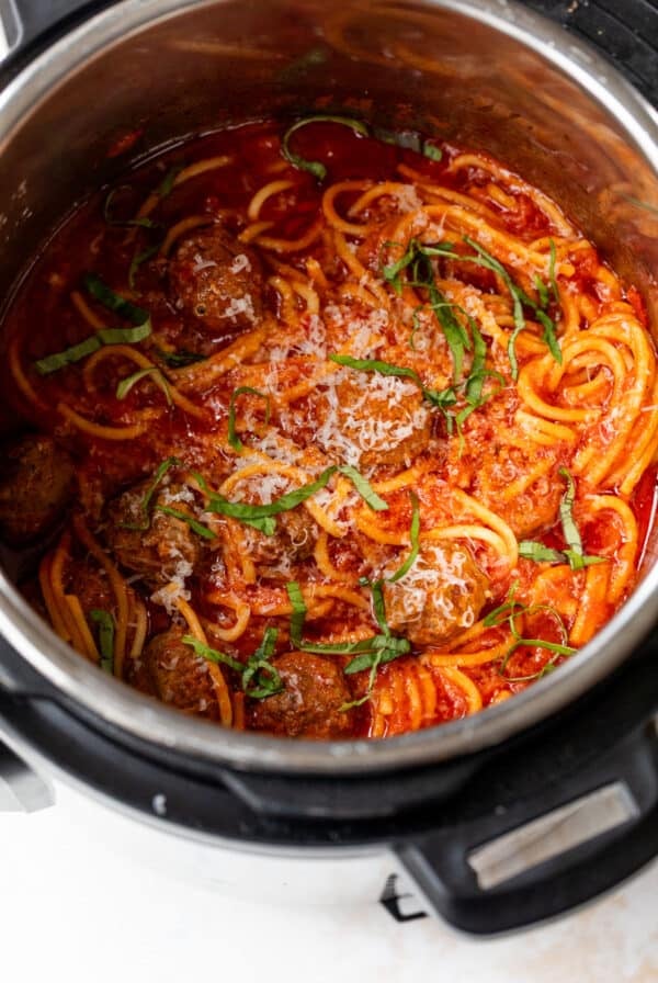 overhead view of spaghetti and meatballs in an instant pot.