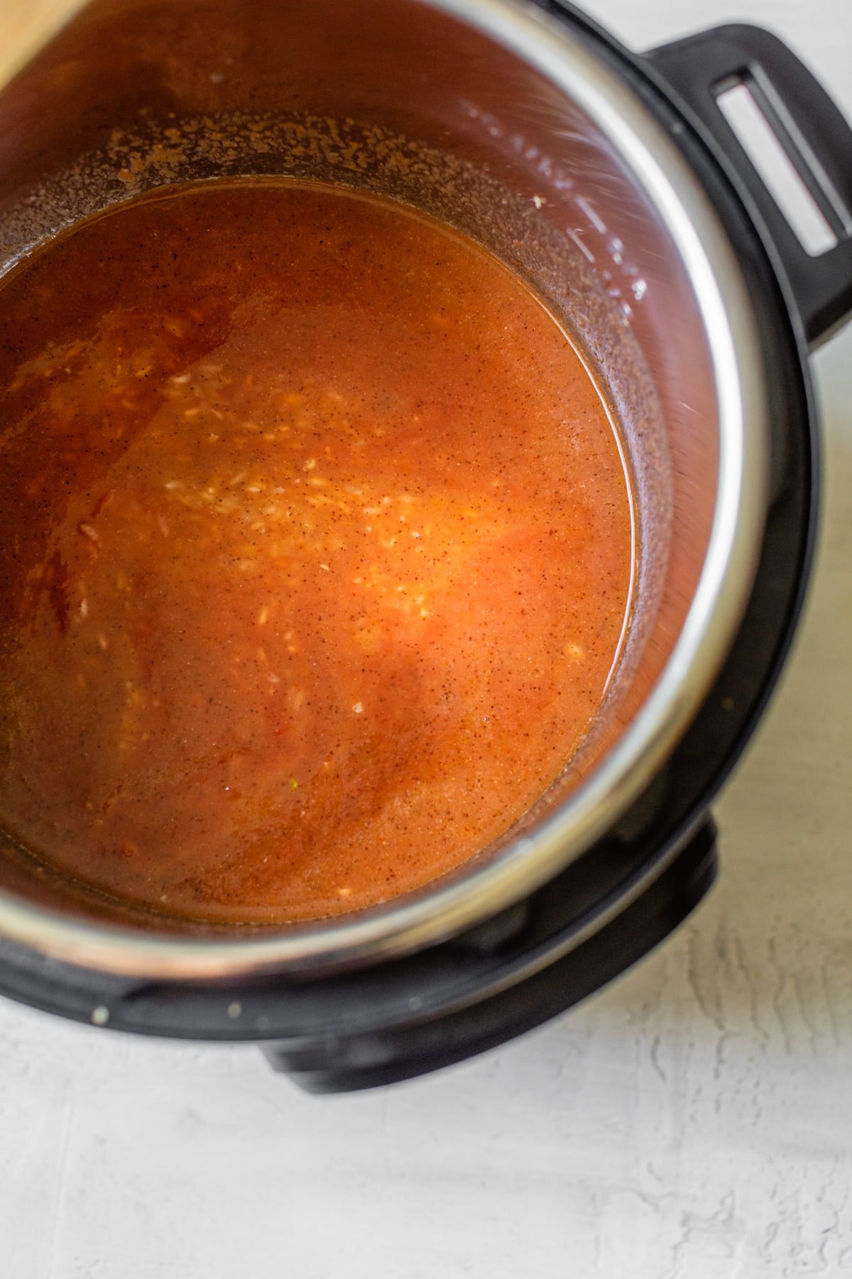 rice and broth in a pressure cooker