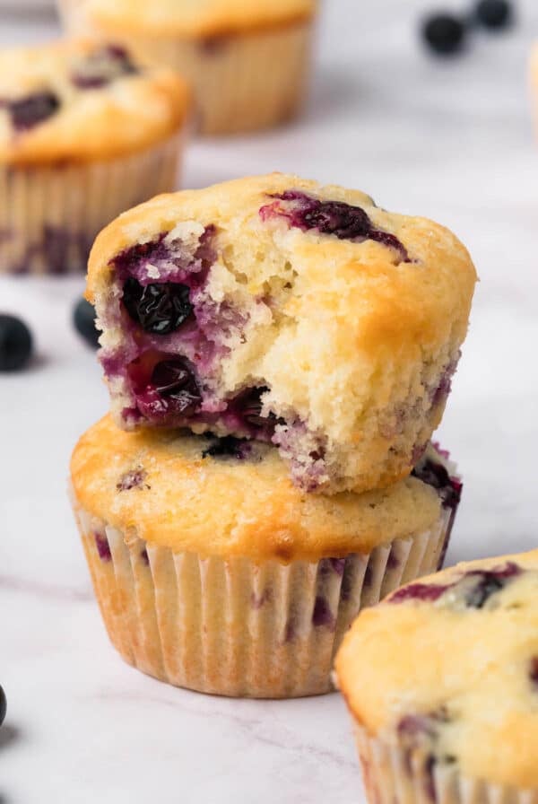side view of a stack of 2 lemon blueberry muffins.