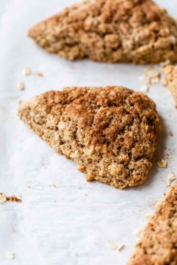 a close-up of an oatmeal scone on a baking sheet