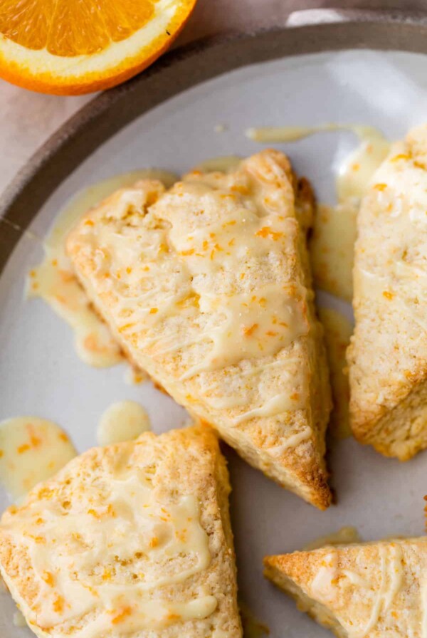 scone topped with glaze and orange zest