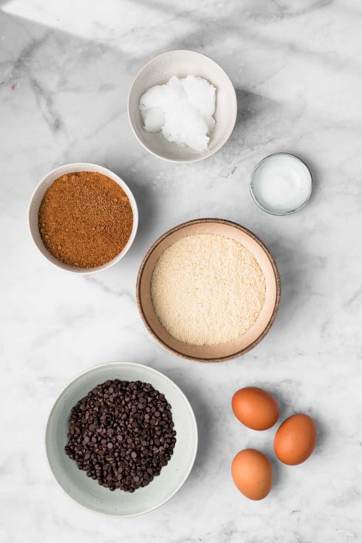 overhead view of the ingredients for paleo brownies in individual bowls.