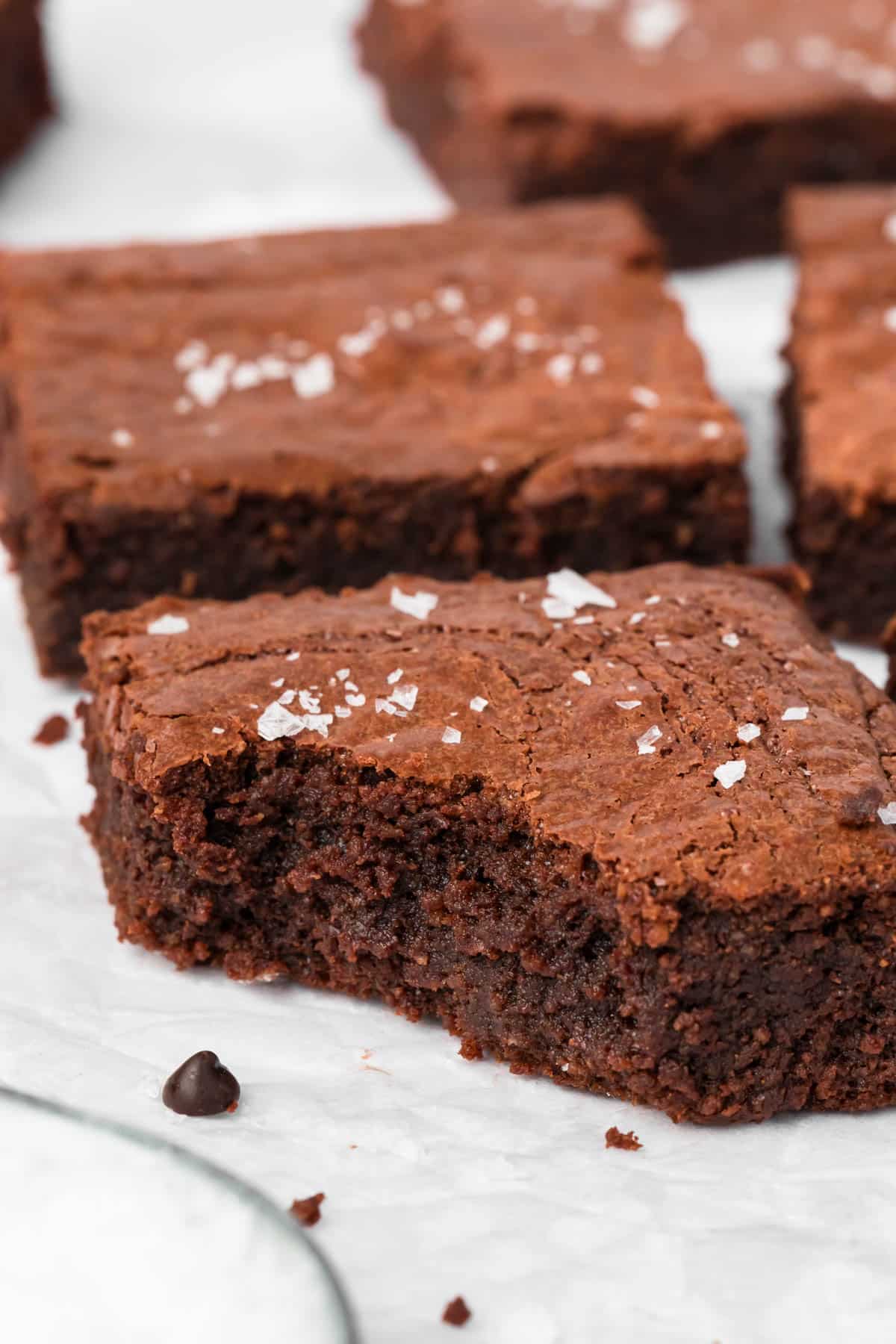 close up on a paleo brownie with a bite taken out of it.