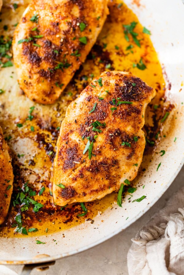 seared chicken breasts in a skillet