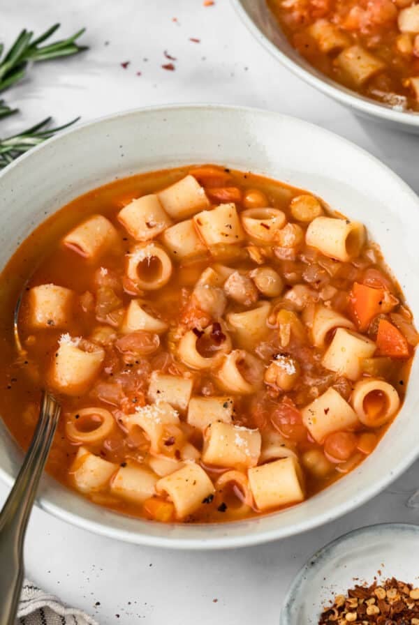 side view of a bowl of pasta e ceci.