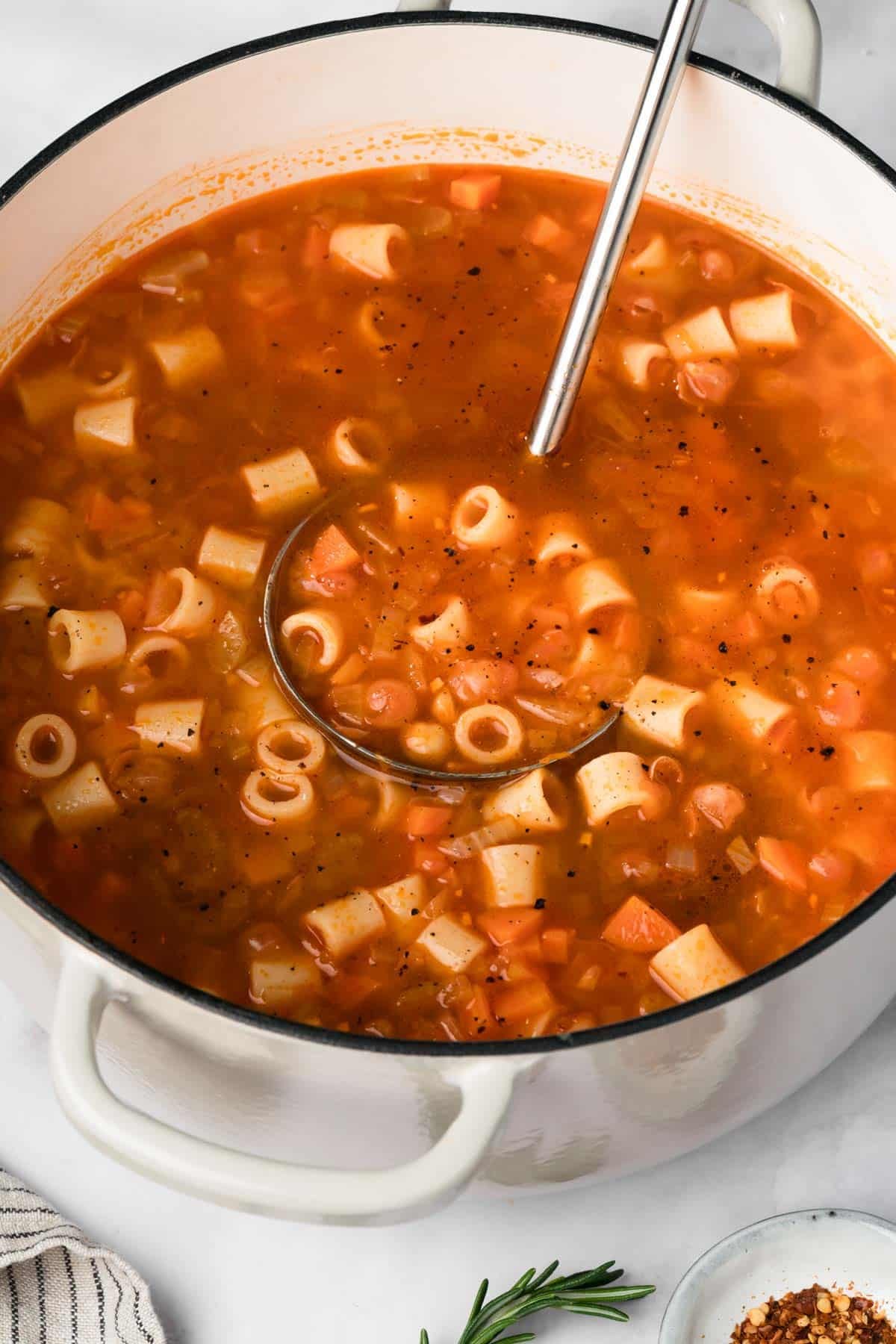 side view of a pot full of pasta e ceci.