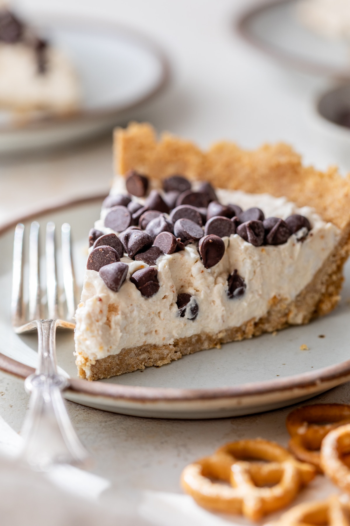 a slice of peanut butter cottage cheese pie on a plate with a fork
