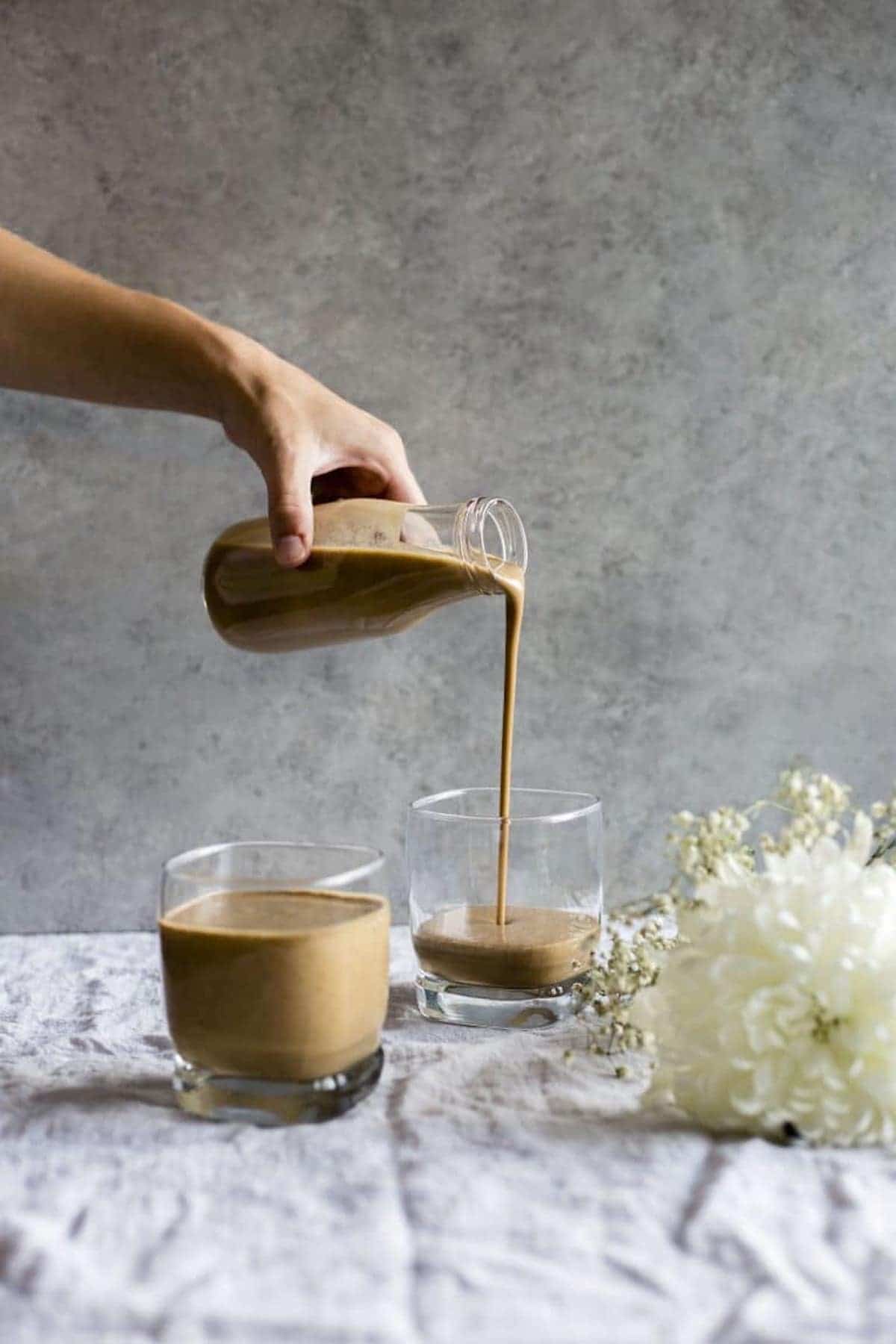 smoothie being poured into a glass