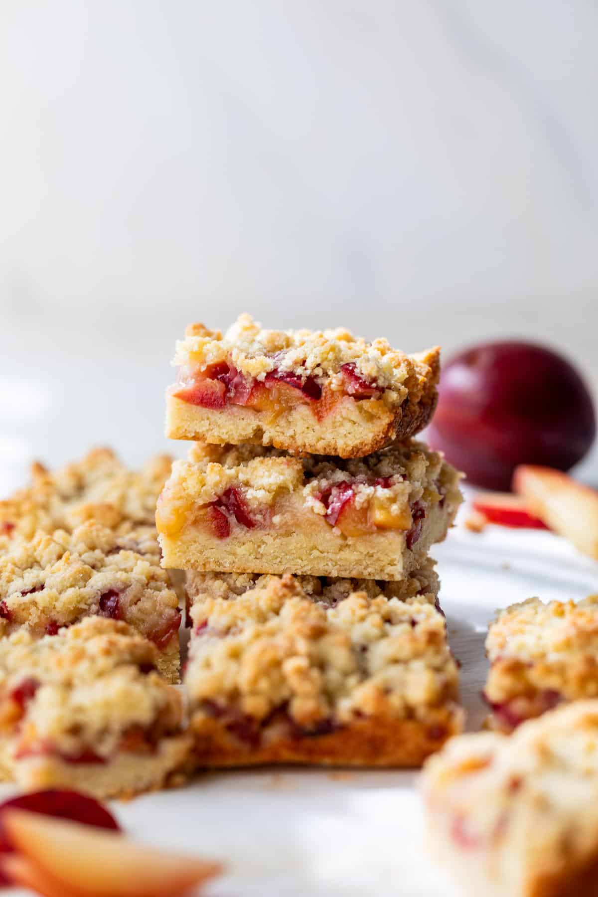 a stack of plum crumb bars.