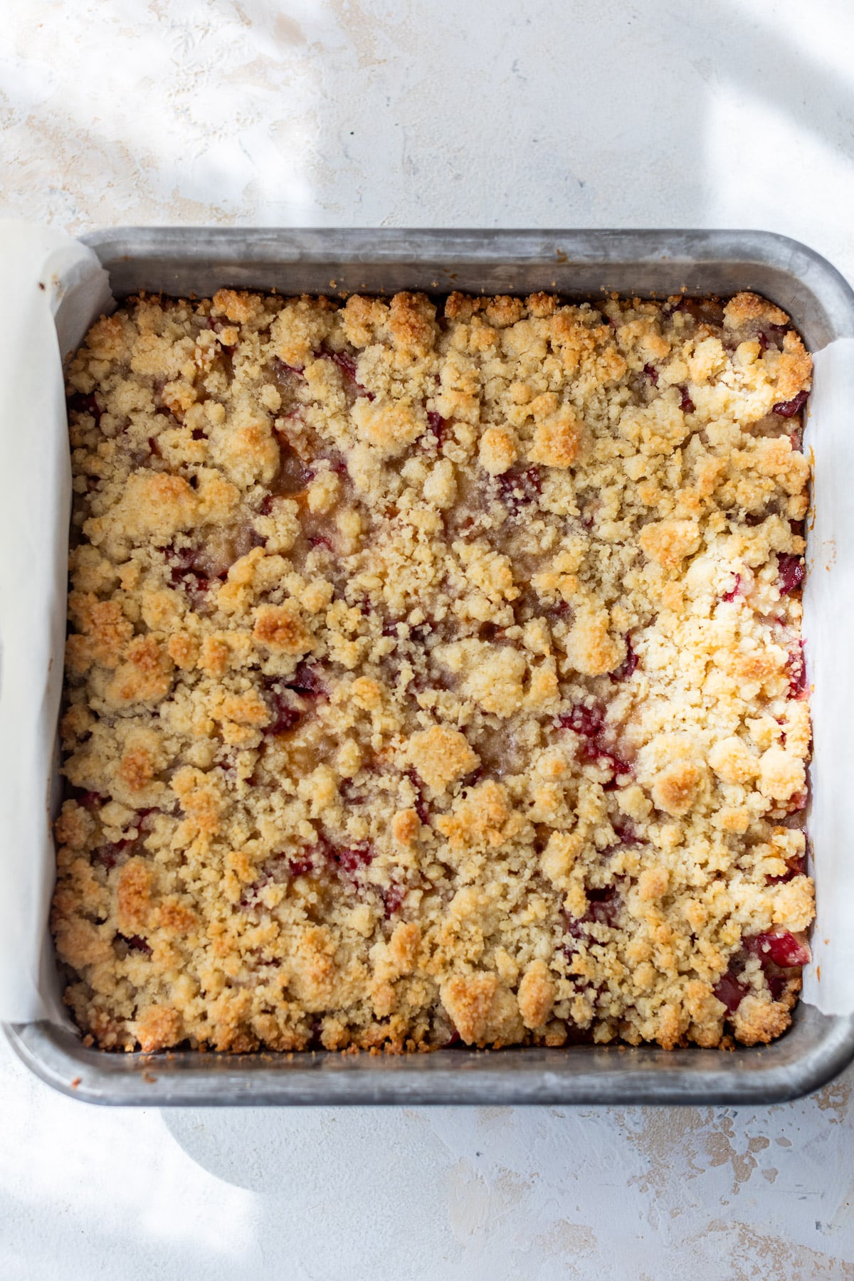 baked plum bars in a baking dish.